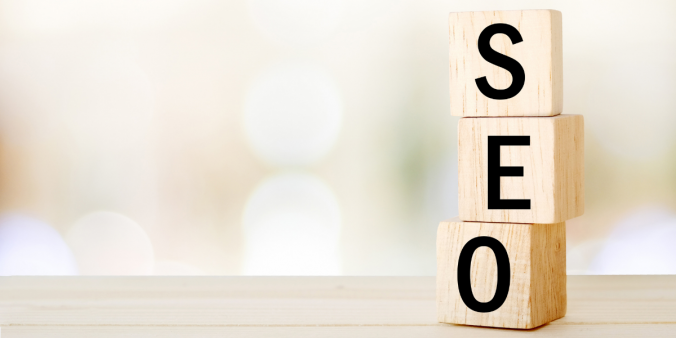 Block letters of SEO resting on top of a table